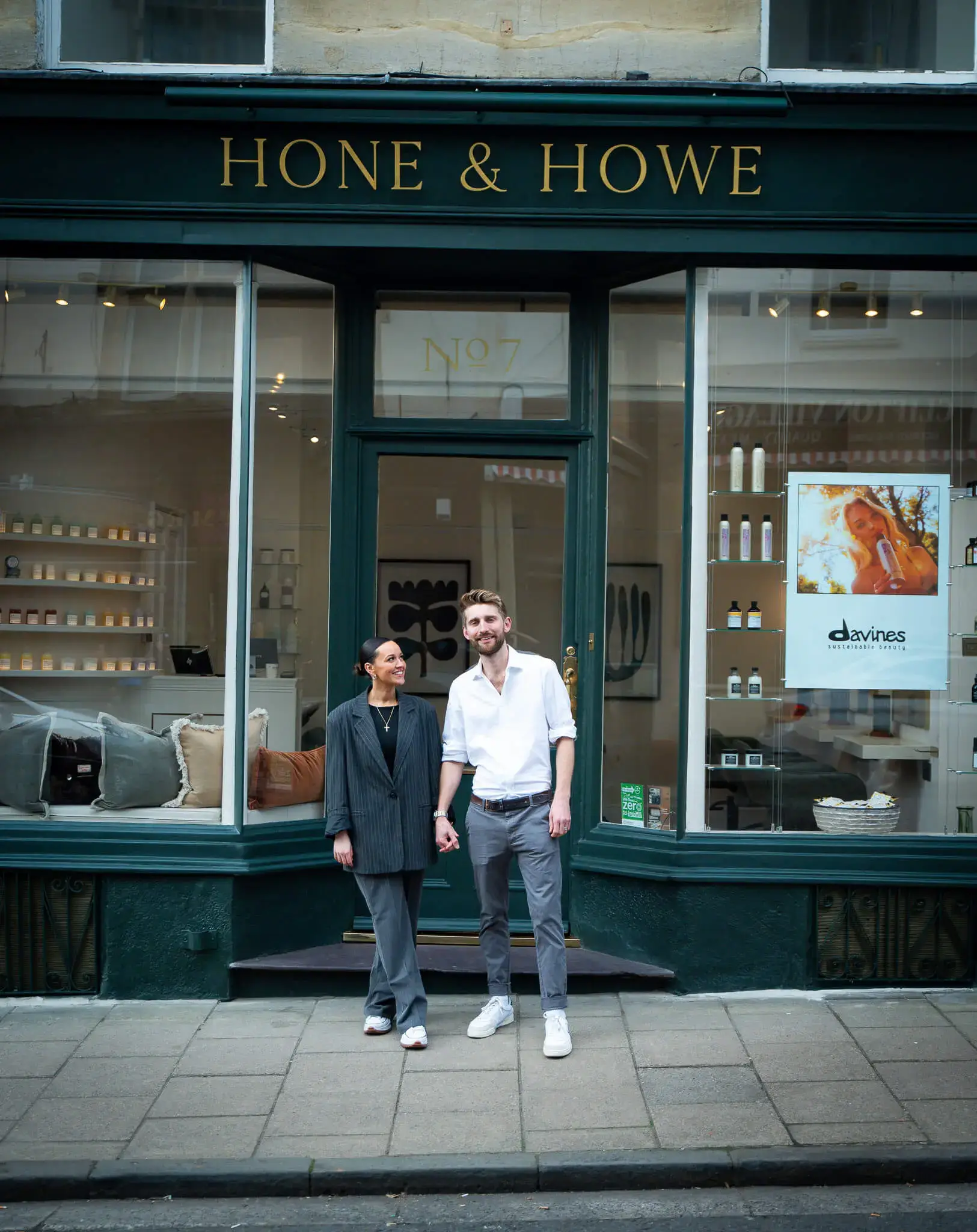 Sam & Gigi standing in front of Hone & Howe salon shopfront